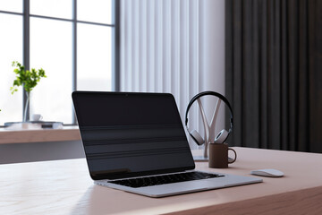 Close u of creative designer desktop with laptop, coffee cup, other items and window with city view in the background. 3D Rendering.
