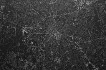 Street map of Charlotte (North Carolina, USA) on black paper with light coming from top