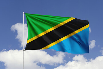 Tanzania flag fluttering in the wind on sky.