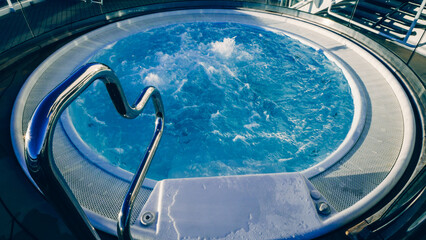 A Relaxing Soak in the Luxurious Hot Tub with a Stylish Metal Hand Rail