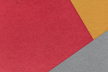 Texture of craft red color paper background with orange and gray border. Vintage abstract wine cardboard.