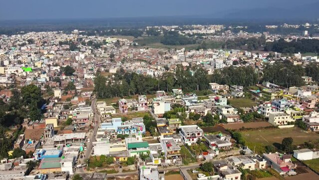 4k Aerial view of All India Institute for Medical Sciences (AIIMS), Rishikesh, India. Drone view of AIIMS in Rishikesh with holy Ganges river flowing along. A sunny day in Rishikesh city. 