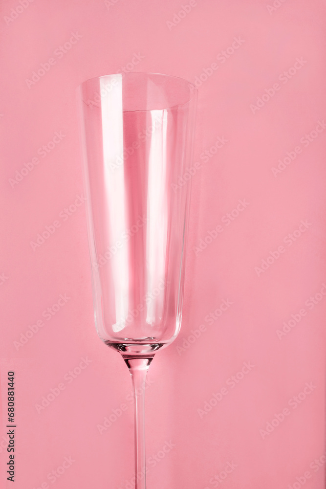 Wall mural Wineglass on pink background