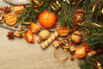 Still life formed with pine branches and New Year sweets	