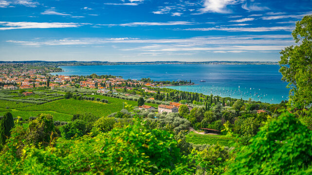Italy, Veneto, Bardolino, View of village on shore of Lake Garda in summer