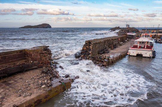 UK, Scotland, North Berwick, Breach in harbor sea defence wall after Storm Babet