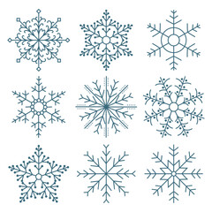 Fototapeta premium Set of hand drawn lacy blue snowflakes on a white background. Winter design elements, vector
