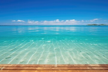 long wooden pier stretching out into crystal clear ocean