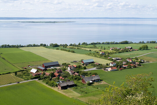 Village and fields by coast