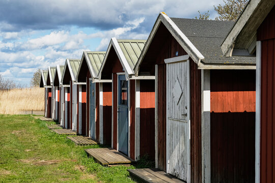 Fishing sheds in a row under clouds