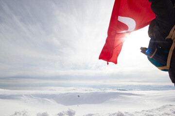 Turkish flag waving at the top of the mountain