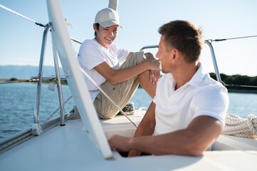Dad and son spending time together on the yacht