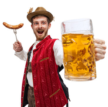 Happy man in traditional fest Bavarian or German outfit with big beer glass and fried sausage celebrating Oktoberfest isolated over transparent background. Alcohol, traditions, holidays, taste concept