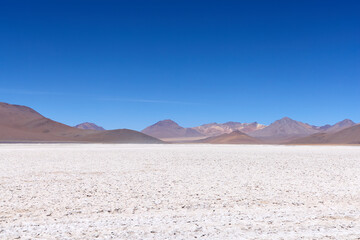 Bolivia, Avaroa National Park. Desert and mountain range on the horizon.