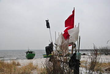 fishing boats in winter on the beach on the Baltic Sea coast