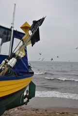 fishing boats in winter on the beach on the Baltic Sea coast