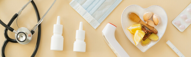 Natural immune system boosters - lemon, ginger, garlic, honey and drugs, thermometer, stethoscope