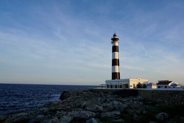 Mediterranean lighthouse on a seashore in Menorca