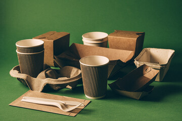 Packaging concept - selection of paper craft packaging on green - 680925024