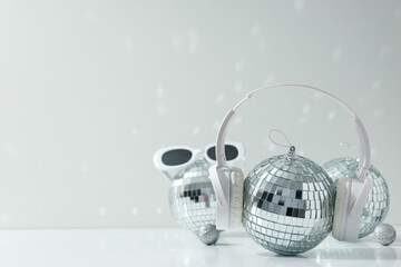 A beautiful disco ball with headphones and glasses