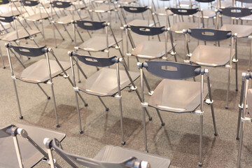 Fototapeta na wymiar A Room Filled With Empty Chairs, Waiting for the Future of Transportation