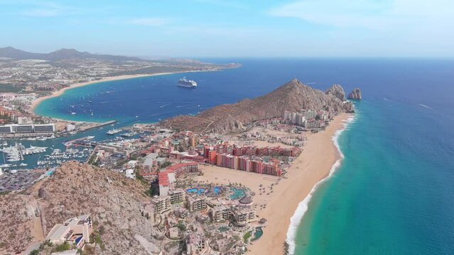 Mexico, Cabo San Lucas: Aerial view of famous resort city on Baja California peninsula, Wejulia Beach and Medano Beach (Playa El Medano) in background - landscape panorama of Latin America from above