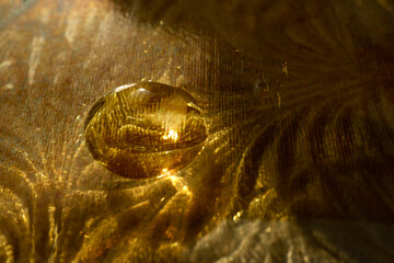 Cosmetic product on golden background