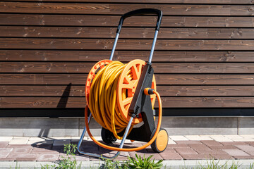 Garden hose for watering plants and flowers. Gardening equipment