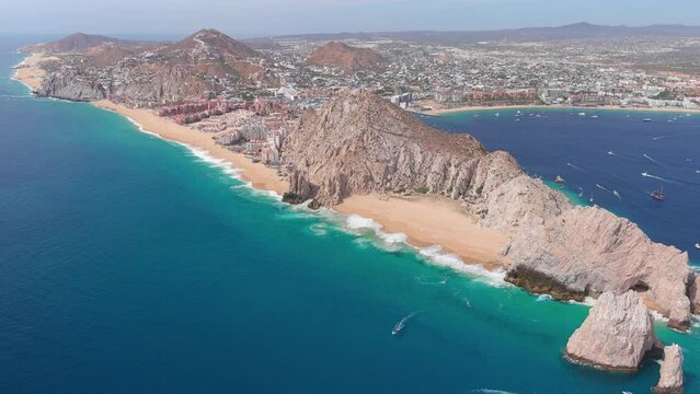 Mexico, Cabo San Lucas: Aerial view of famous resort city on Baja California peninsula, Wejulia Beach and Medano Beach (Playa El Medano) in background - landscape panorama of Latin America from above