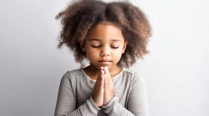 Fotobehang Hopeful Child Praying: Emotional Image on whiteBackground © Kristian