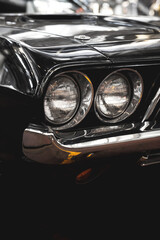 Close-up photo of headlights of an old classic car. poster