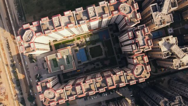 Aerial view of Greater Noida City in Uttar Pradesh, India. Construction of a multi-story Residence apartment building. Drone shot of modern City high-rise skyscraper buildings in India.