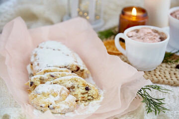 Aesthetic Christmas seasonal bread stollen - a rich German fruit and nut loaf. Holiday season. Cozy home