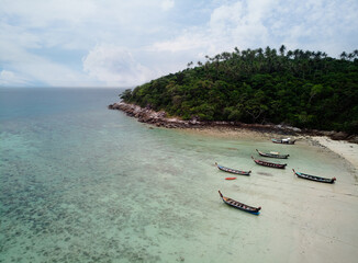 Travel Asia. Beautiful tropical seascape.Traditional thai longtail boats in blue lagoon