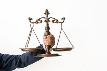 lawyer holding scales of justice Focus on scales on white background, law concept