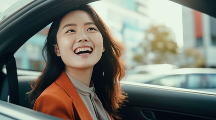 Young beautiful asian women getting new car. she very happy and excited looking outside 