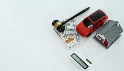 Auctioneer knocks down property sale by sample house and lawyer's gavel, judge mediates in property dispute in court car judge's gavel on wooden background Buying and selling real estate, housing