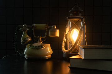 A study of the last century, a vintage telephone and a lamp