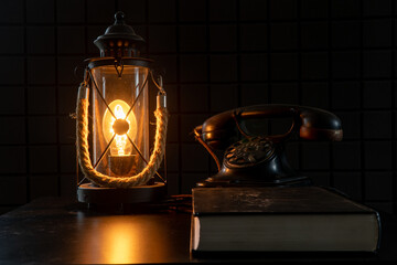 Vintage lamp and telephone. A study with rarities. A cozy atmospheric photo that transports us to...