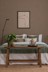 Aesthetic composition of warm bedroom interior with mock up poster frame, black lamp, stylish bed,...