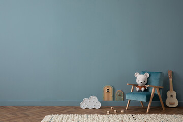 Cozy composition of blue living room interior with copy space, gray desk, green chair, plush dog,...