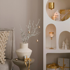 Beautiful composition on white design shelf with christmas decoration, lights, gifts, lanterns...