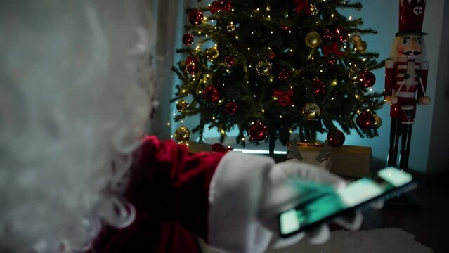 Modern Santa scrolling social media with his Phone