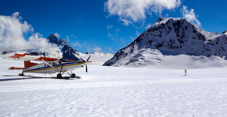 Tourist Ski Plane landing on a snow field in the Southern Alps on the south island of New Zealand. ...