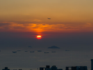 Seascape with airplane sunset island view