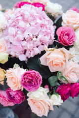 White, beige wedding bouquet. Bride, hands, arms