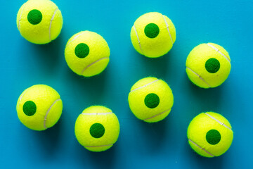 Set of green tennis balls, top view. Sport games background