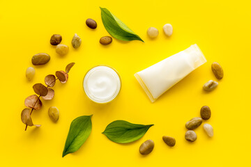 Layout of cosmetic moisturizer face skin cream in glass vial, top view