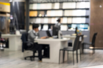 Fototapeta na wymiar Blur image of modern office with businessman working at desk.
