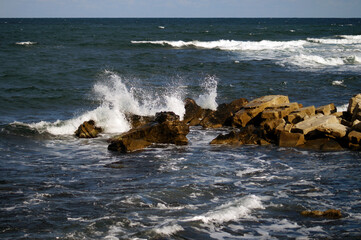 Sea waves crashing on rocks